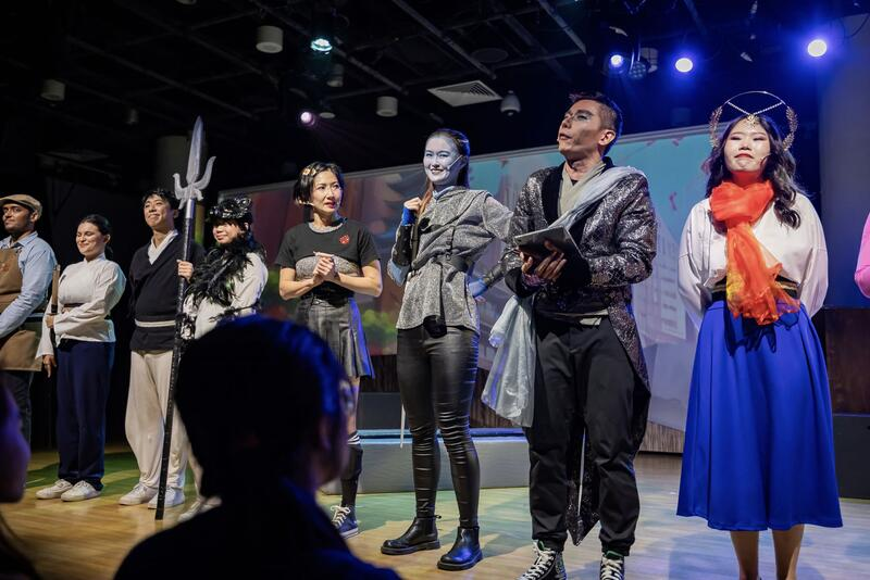 Performers taking a bow on stage
